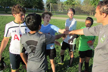 Players being coached on the field