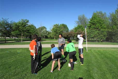 Players being coached on the field
