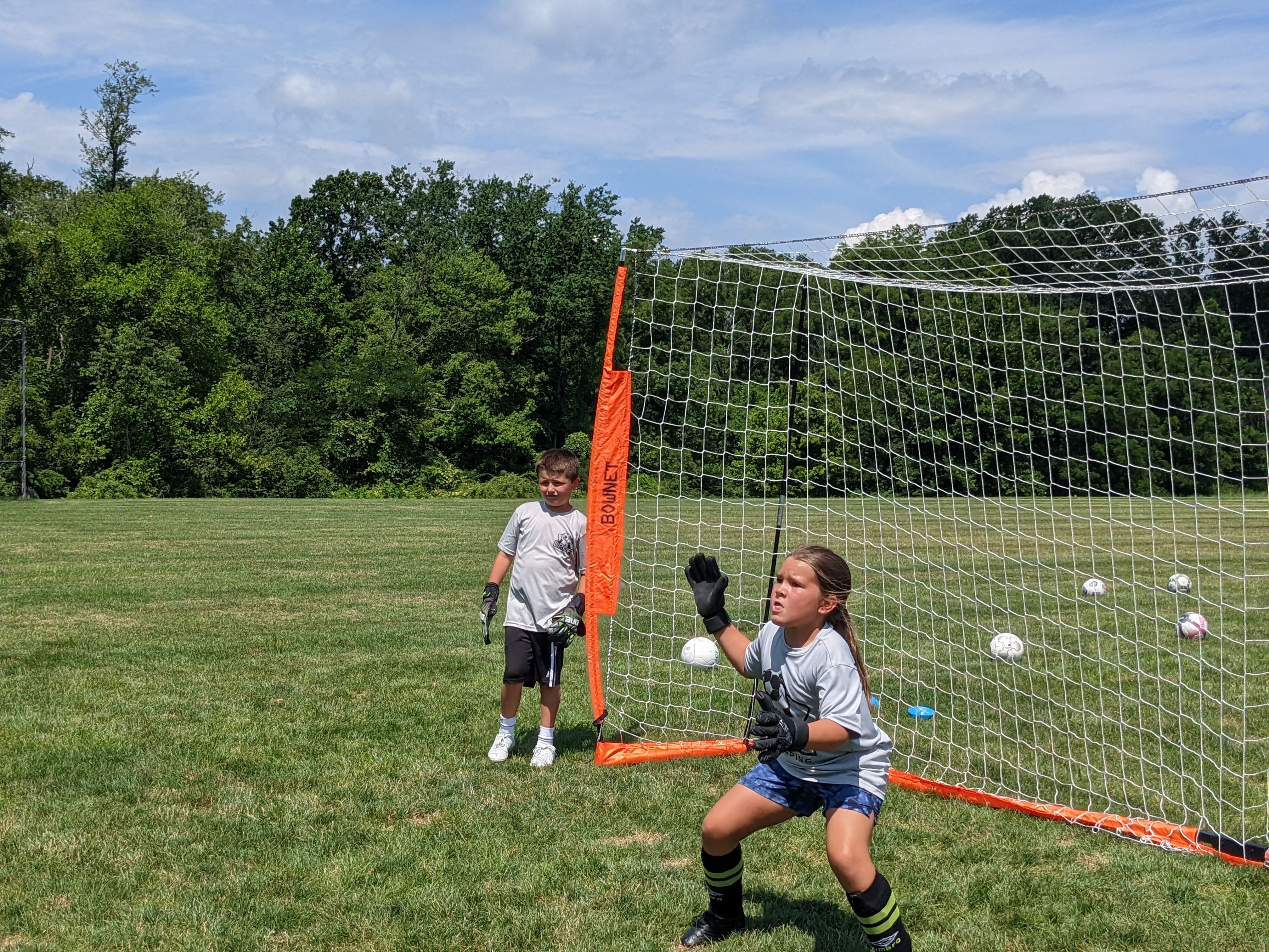 Girl goalkeeper making saves